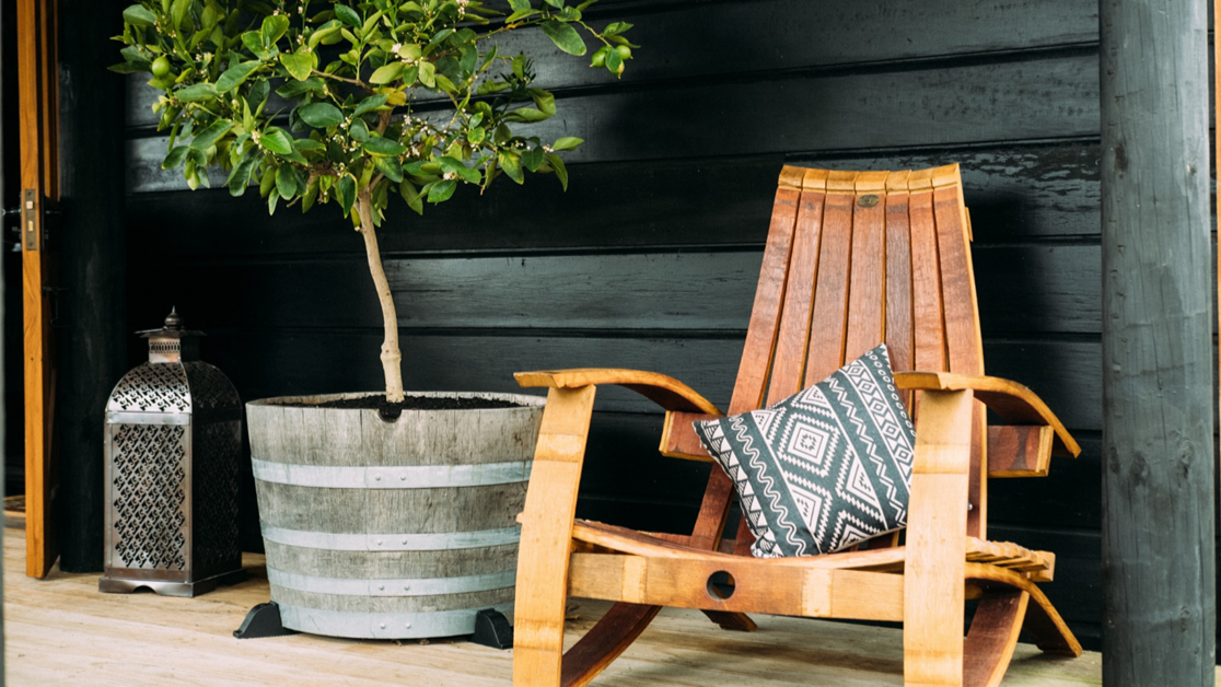 OAKENZ barrel feet lifting half wine barrel planter off wooden deck