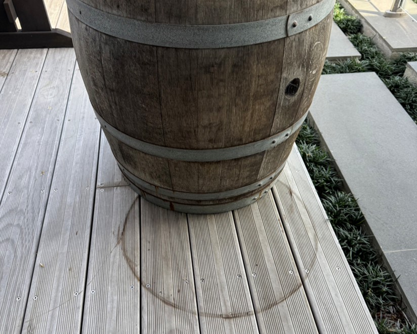 image of stains on deck caused by wine barrel